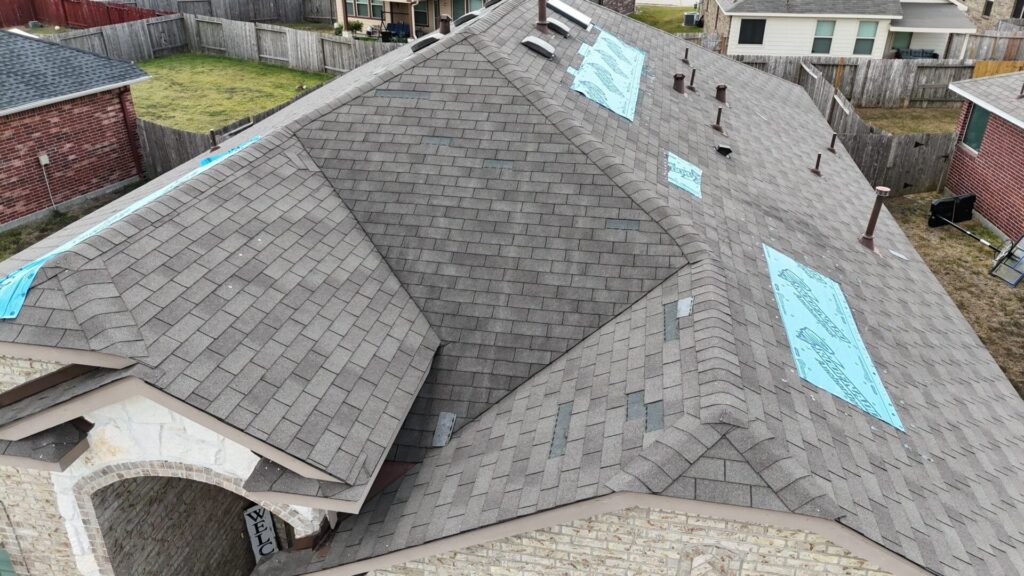 a home having a tarp on a roof after a storm